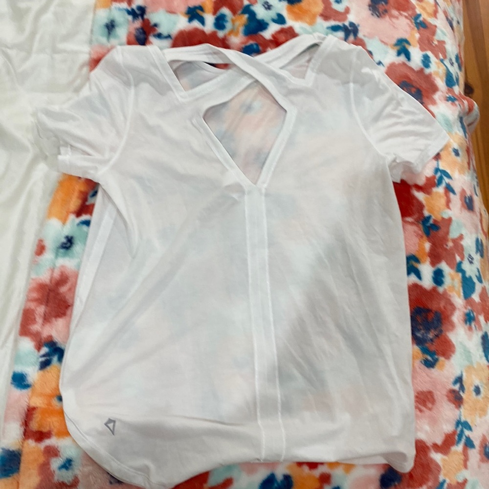 White ivivva shirt cool design in the back